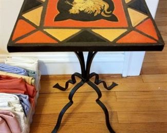 Wrought iron base table with tile top. $40