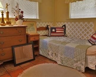 Twin bed and wooden dresser