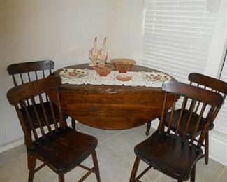 Round drop leaf table and chairs
