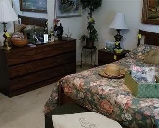 Dresser with mirror, art work and accessories.