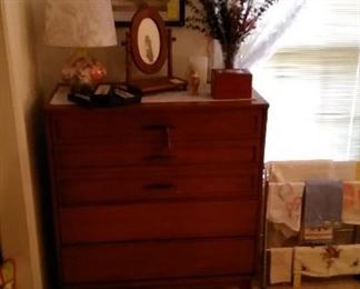 Mid Century Modern chest of drawers with accessories.