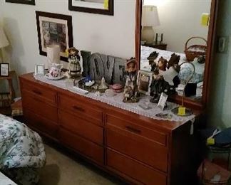 Mid Century Modern dresser with mirror and accessories.