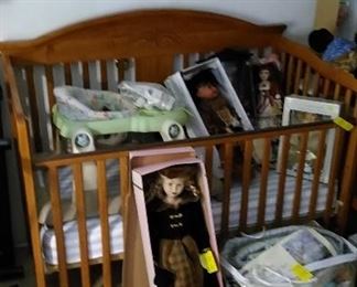 Baby crib, dolls and accessories.