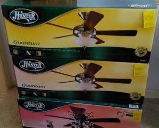 3 Hunter ceiling fans still in the original box, ceiling light fixture.