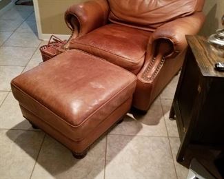 Leather chair and ottoman matches living room sofa also offered for sale