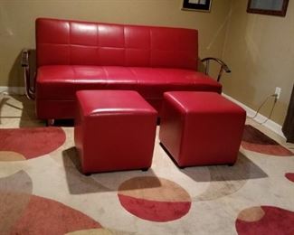 Ashley Furniture, leather flip flop convertible sofa opens out to bed, Also red matching ottomans