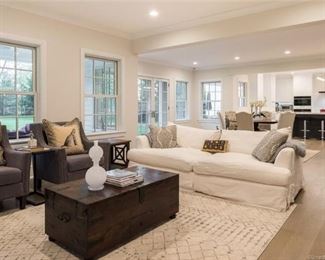 ARHAUSE SLIPCOVER CREME SOFA AND CAPTAINS CHEST COCKTAIL TABLE opens for storage . Chairs NFS.