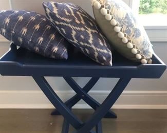Many Pillows and Linens and Blue Tray Table 