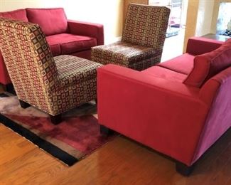 Contemporary Red Sofas, Patterned Armless Chairs and Area Rug