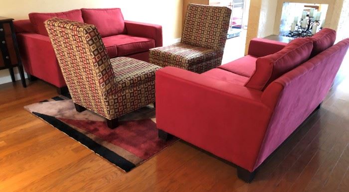 Contemporary Red Sofas, Patterned Armless Chairs and Area Rug