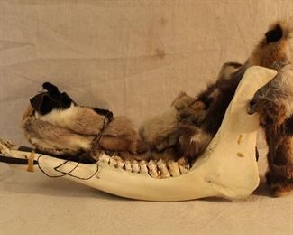 Alaska Native Inuit caribou jaw bone dog sled with dolls (carved wood faces)