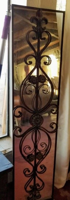 Iron Framed Mirror. The mirror has a crack near the bottom.