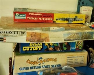 Vintage toys include: Renwal Polaris Thomas Jefferson model, Revell USS Constitution model, still shink-wrapped, Hot Wheels Baja Cutoff race set, Ding-A-Linggs Super Return Space Skyway with robot.