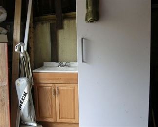 Upright freezer works great, bathroom vanity (also works great) Oreck vacuum.