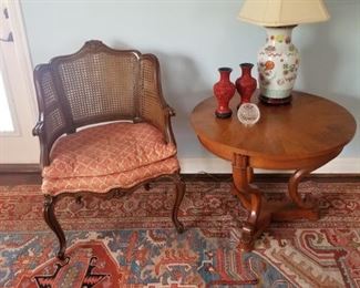 cane back chair with antique side table