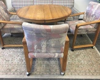 42 Round Table with Three Upholstered Rolling Chairs