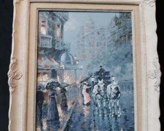 Framed canvas painting of a rainy evening in a European city. Unknown artist.