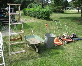 Lawn mowers and wheelbarrow