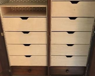 Close-up look at drawers in armoire.