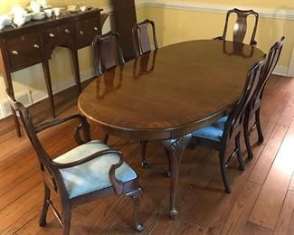 Exceptional dining table with leaves and six chairs.