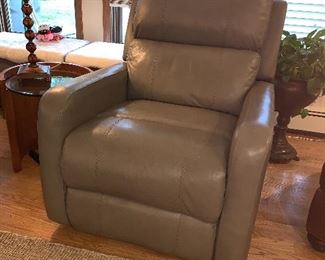  1 of 2  matching gray leather rocker/recliners -  The color is off in this picture
