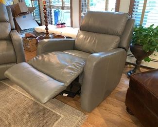  1 of 2 matching gray leather rocker/recliners 