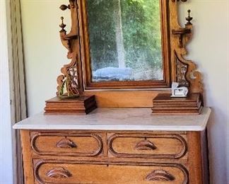 Antique marble top Victorian era walnut dresser with ornate mirror and built-in jewelry boxes