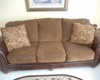 Leather & fabric sofa w/ 2 pillows - 3 cushions back ones attached https://ctbids.com/#!/description/share/209126