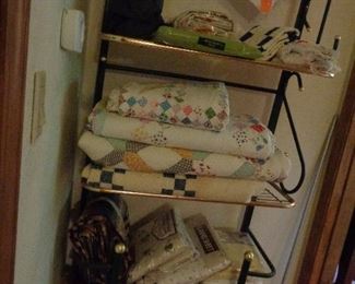 bakers rack, quilts, new sheets, misc