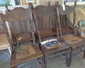 set of 6 vintage oak pressed back chairs w/cane, 1 damaged