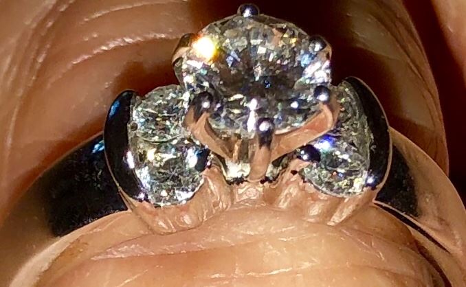 One karate total weight diamond ring set in white gold.  Estimate the ring to be about a six. 