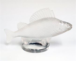Lot 16: A Lalique Crystal "Perche" Car Mascot.  Fish form hood ornament with acid etched "Lalique France" in block letter.  Minor surface scratches at underside.  6 1/4" long. 