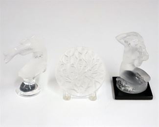 Lot 19: Three pieces of Lalique Crystal.  Including two figures, one fish and the other a woman on a rock, and a crystal Christmas ornament ("Noel 1988").  All three with etched signature "Lalique France".  Minor wear.  Up to 3 1/4" high. 