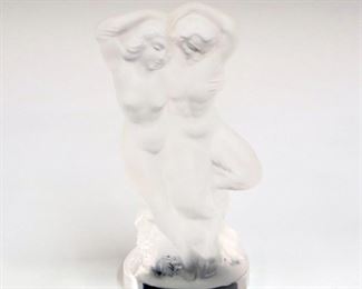 Lot 22: A Lalique Crystal "Pan & Diana" Figure.  Consisting of a Satyr and a woman embracing.  Etched signature "Lalique France".  Slight wear.  5 1/2" high. 