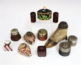 Lot 39: A Collection of Twelve Inkwells.  Late 19th and 20th century inkwells of various shapes and sizes including shells, porcelain, a deer hoof, leather, metal, and wood.  Wear and some small losses and dings overall, but pieces are intact.  Up to 4" high.