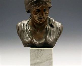 Lot 45: G. Riva, Italian, 19th Century. Bronze bust of a peasant woman with a scarf or covering her hair, signed "G. Riva"; resting on a marble plinth. Wear to the patina. 17 1/2" high overall. 