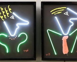Lot 46: A Pair of 20th Century Mixed Media Pictures by J. Hill, n.d.. Each is comprised of a painted canvas with neon lights, entitled "He/2" and "She/2". Both are signed "J. Hill" at the lower right and are in painted black frames. Some nicks to the frames. Each 25 5/8" x 31 3/8" high overall.