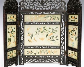 Lot 50: A Chinese Diminutive Screen.  Three panel screen with hardstones and carved wood frame.  Loss, damage, one panel is cracked.  13 1/2" high. 