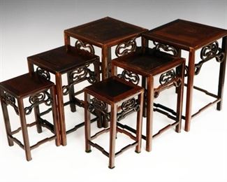 Lot 54- Six Chinese Hardwood Display Tables.  Comprised of two sets of three.  Minor wear to each.  Up to 11 1/2" high. 