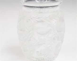 Lot 9: A Lalique Crystal "Bagatelle" Vase.  Frosted and clear crystal with repetitive bird motif.  Etched signature "Lalique France" and includes label.  At least one minor nick noted.  6 3/4" high.