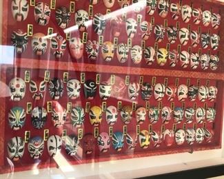 Chinese miniature masks in frame $125
