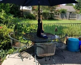 #32 metal table w 4 chairs as is rust $75.00
without umbrella