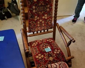 #3 antique glider rocker w stool covered in orental carpet $125.00