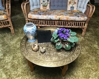 Extra large Brass piece being utilized as a table.