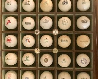 Souvenir golf balls in display case