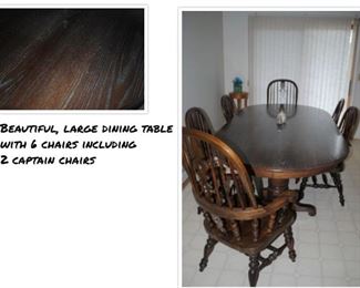 Beautiful, large dining table with 6 chairs including 2 captain chairs