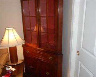 Pair of corner cabinets, lighted. Beautiful condition