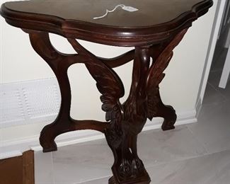 Half table with carved Crane figure