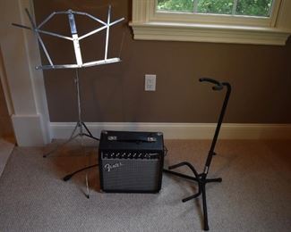 Fender Champion 20 amp, music stand and guitar stand