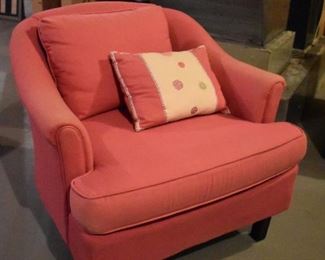 One of a pair of pink armchairs